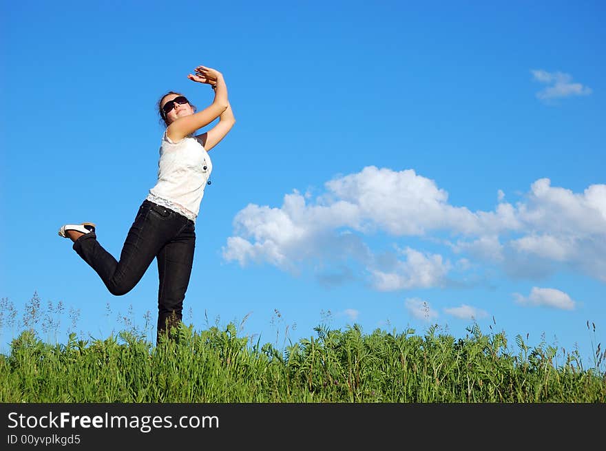 Beautiful girl over a blue sky