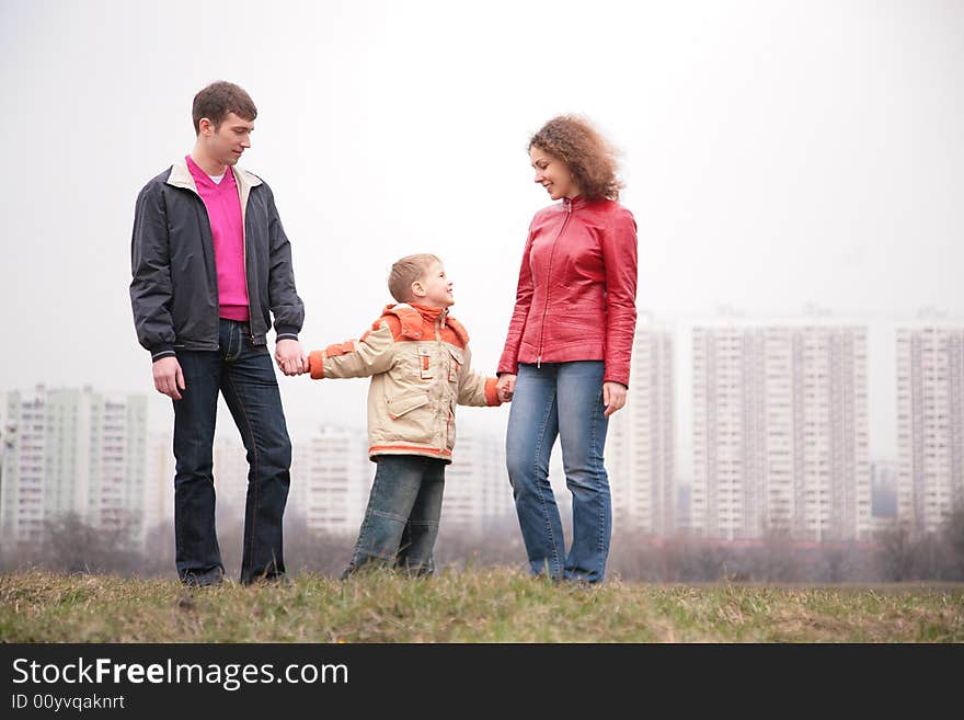 Family stand outdoor in the city on spring