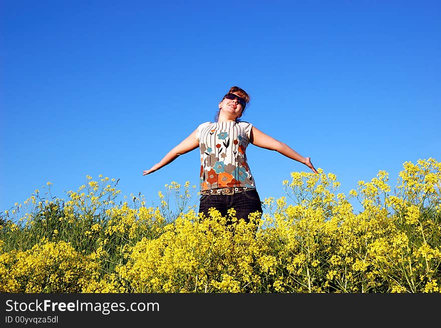 Beautiful girl over a blue sky