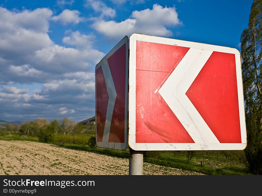 Highway series: red and white road sign on the way