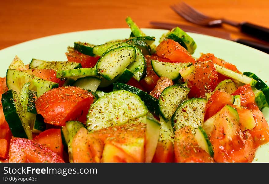 Fresh vegetable salad with spices close up