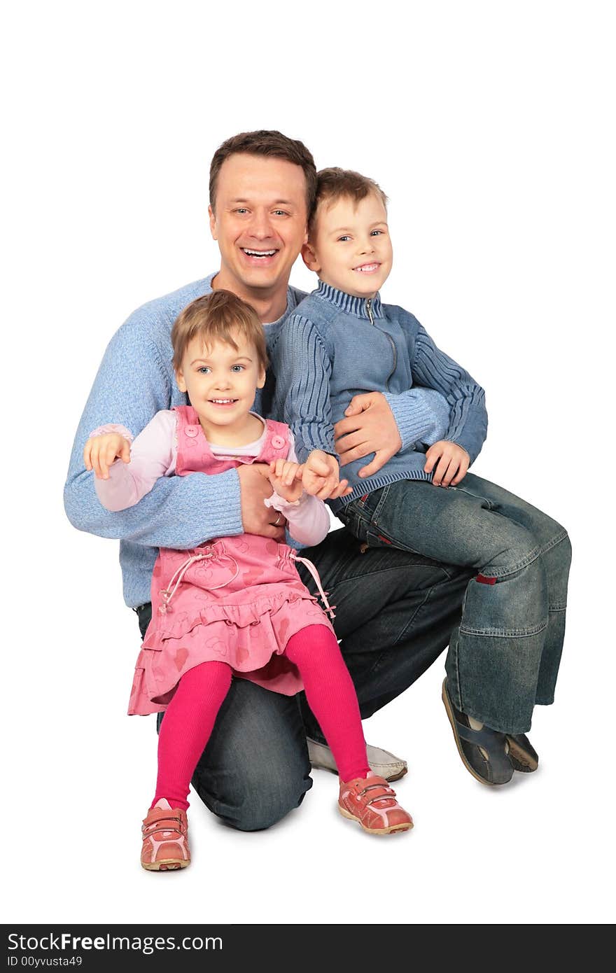 Father with children sit on laps on white