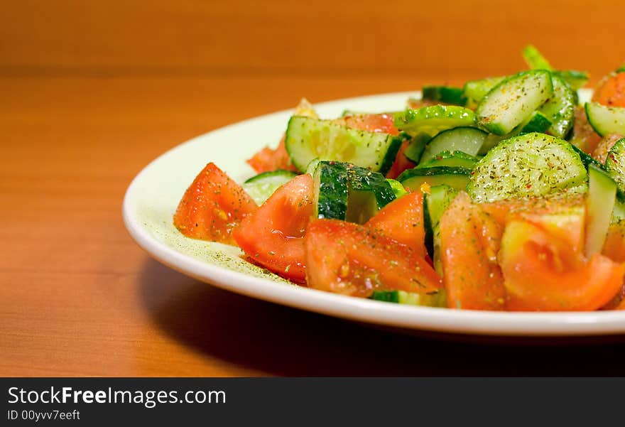 Fresh vegetable salad in plate on the table