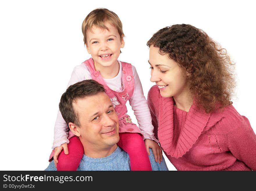 Daughter on father`s shoulders and mother on white