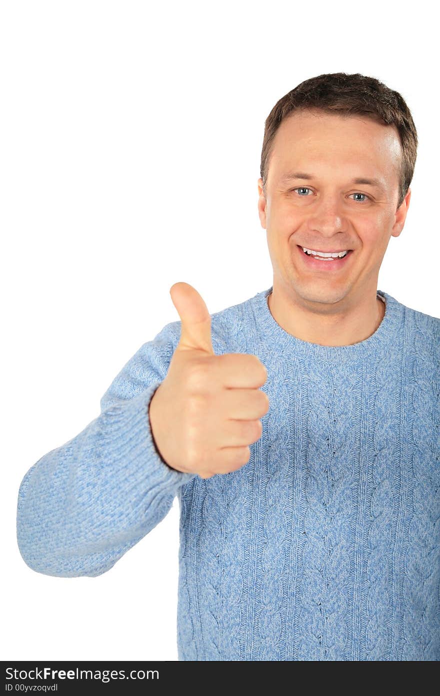 Man in blue sweater makes gesture by finger