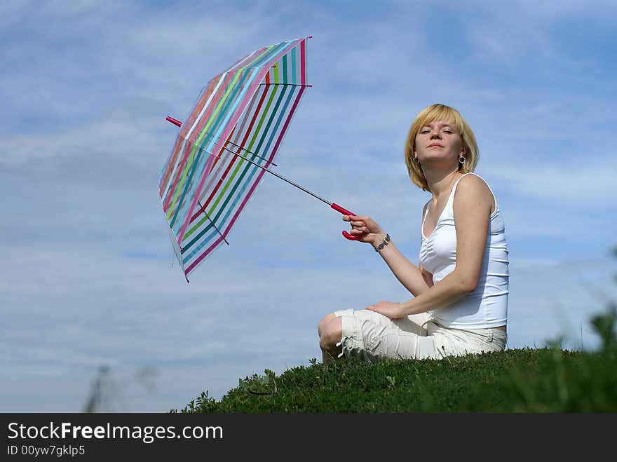 Young charming girl with umbrella