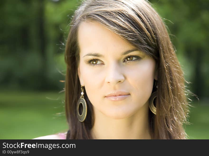 Young Woman On The Green Background. Young Woman On The Green Background