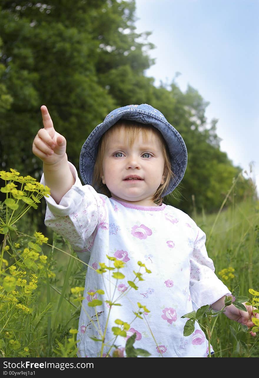 Cute little girl a background of a landscape. Cute little girl a background of a landscape