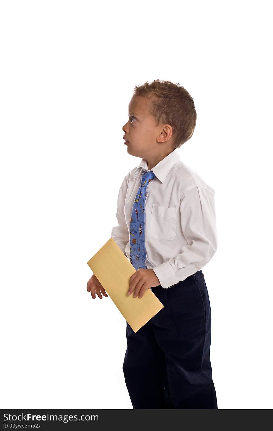 Young boy dressed as businessman holds envelope - isolated on white