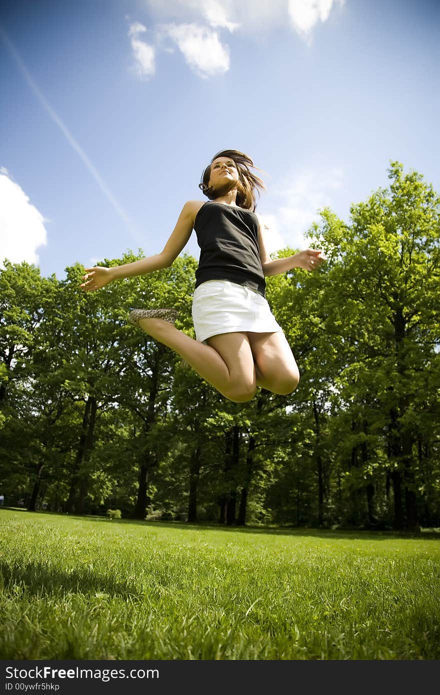 Happy Young Woman Is Jumping. Happy Young Woman Is Jumping