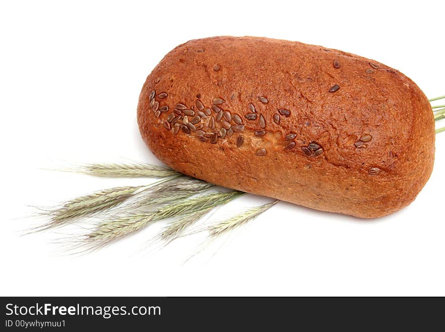 Bread with wheat ears isolated on white. Bread with wheat ears isolated on white.