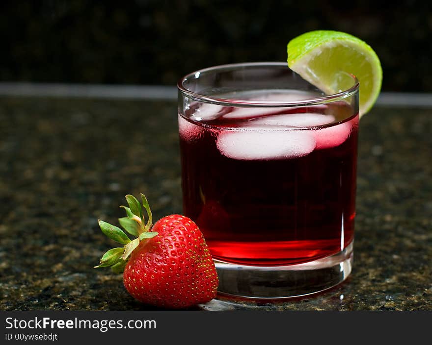 A summery drink with lime and strawberry. A summery drink with lime and strawberry