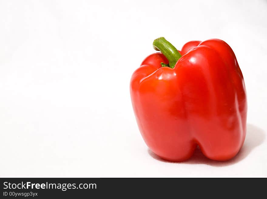 A ripe red pepper fresh from the garden. A ripe red pepper fresh from the garden