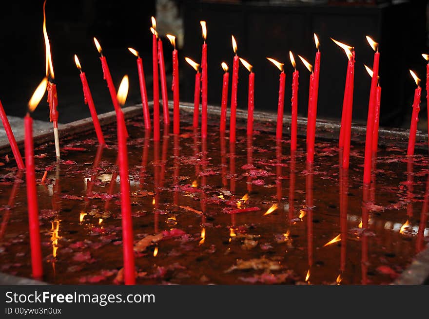 Burning Candles In The Water Pan