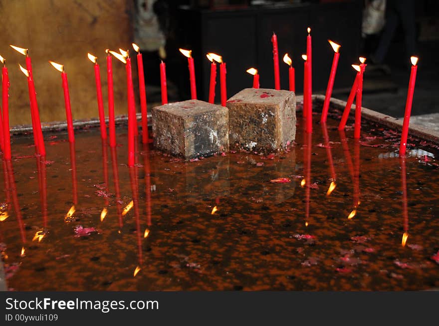 Burning candles in the water pan