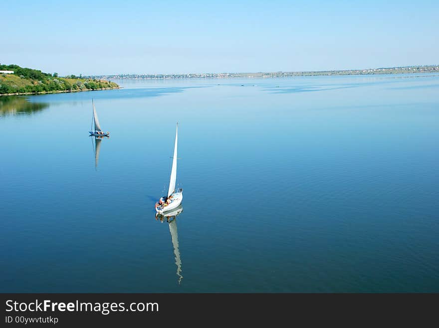 Calm river scenic with yachts. bird fly view