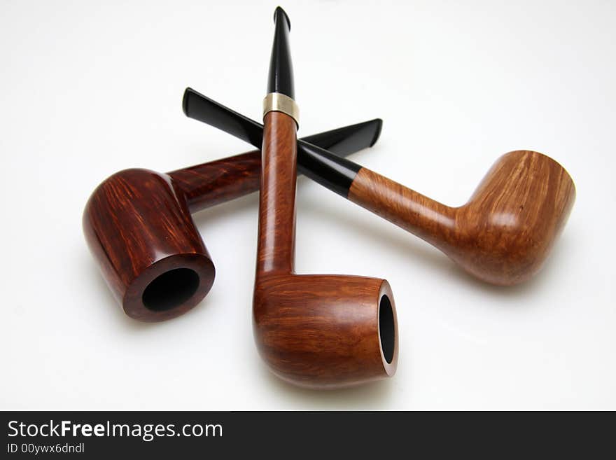 Three tobacco pipe isolated on white background.