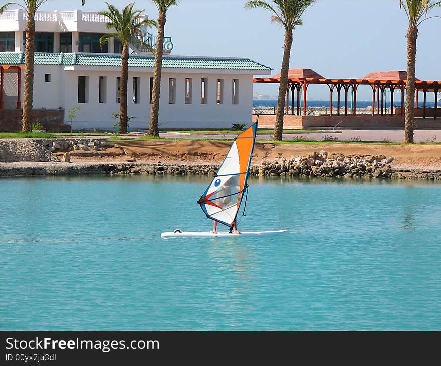 Man surfing on sea near coast