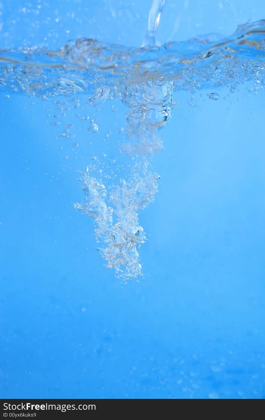 Photo of seething fresh water on the blue background. Photo of seething fresh water on the blue background