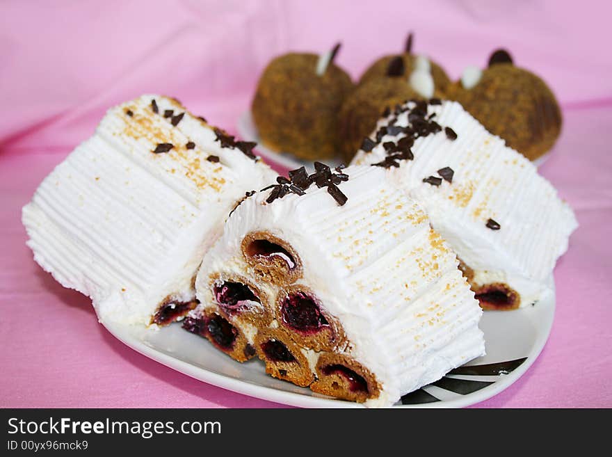 White cream Cake on a rose background