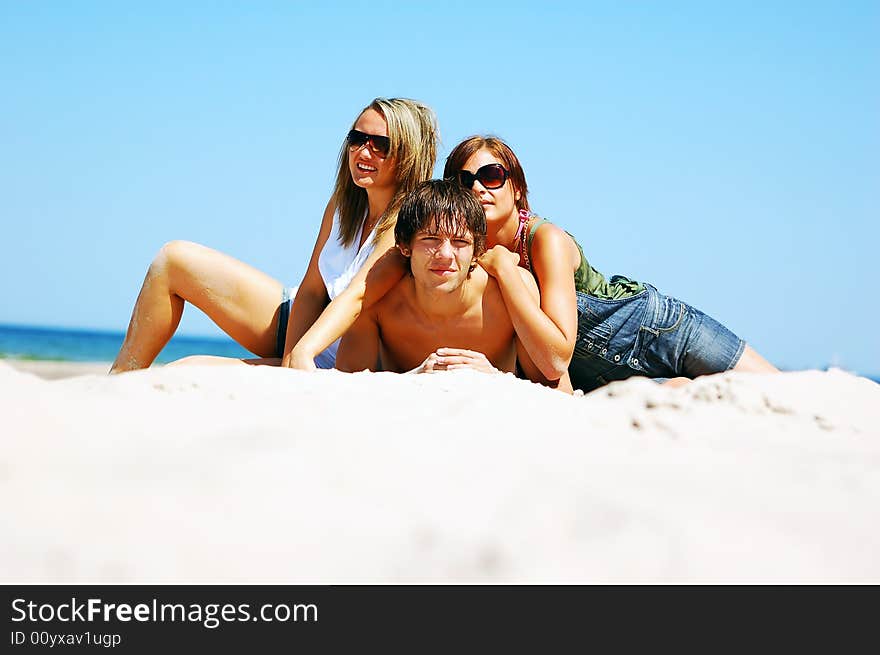 Young Friends On The Summer Beach