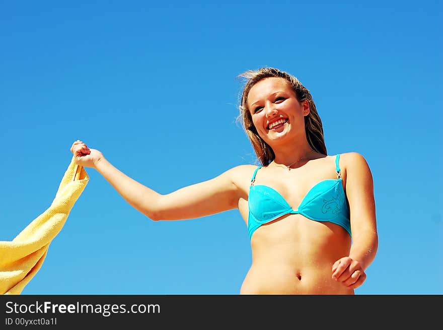 Young attractive woman enjoying summertime on the beach. Young attractive woman enjoying summertime on the beach