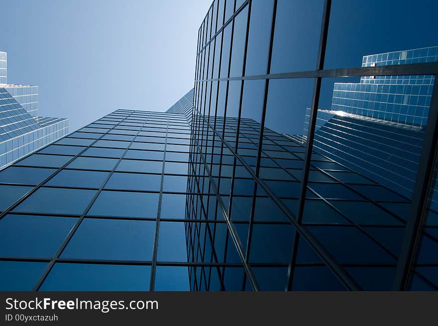 View of a modern downtown office buildingwith reflective window. View of a modern downtown office buildingwith reflective window