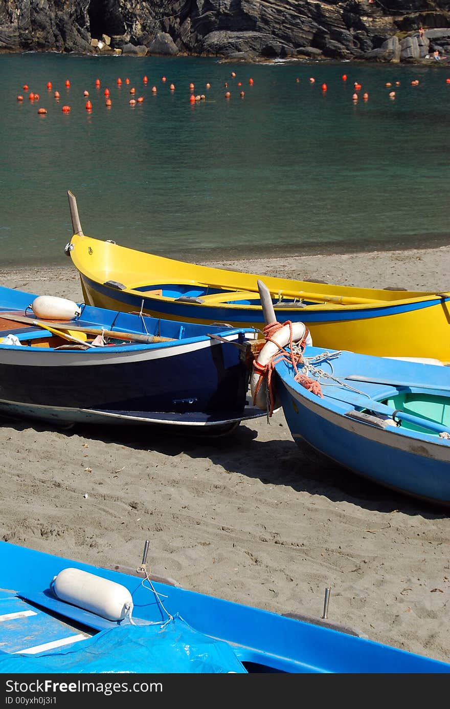 Coloured boats on a beach