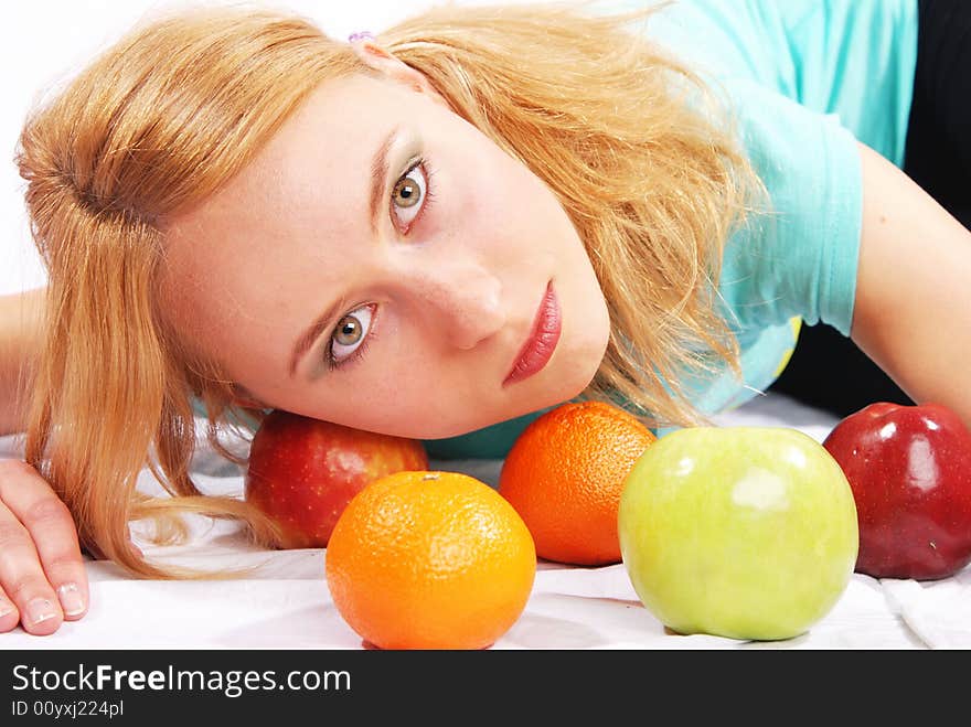 The girl with  fruit on a white background. The girl with  fruit on a white background