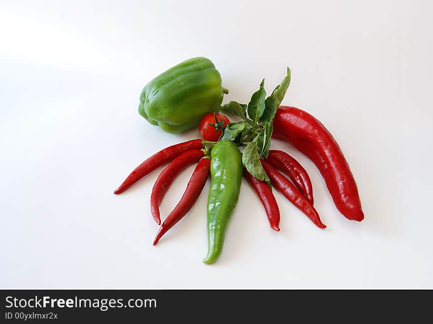 Kitchen vegetable chili-pepper peppers and tomatoes