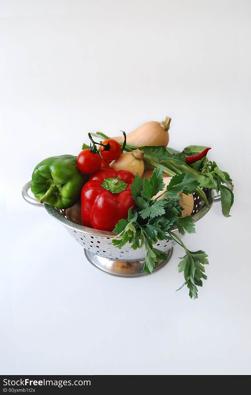 Healthy Kitchen Detail with colander full of fresh peppers being prepped for salad. Healthy Kitchen Detail with colander full of fresh peppers being prepped for salad.