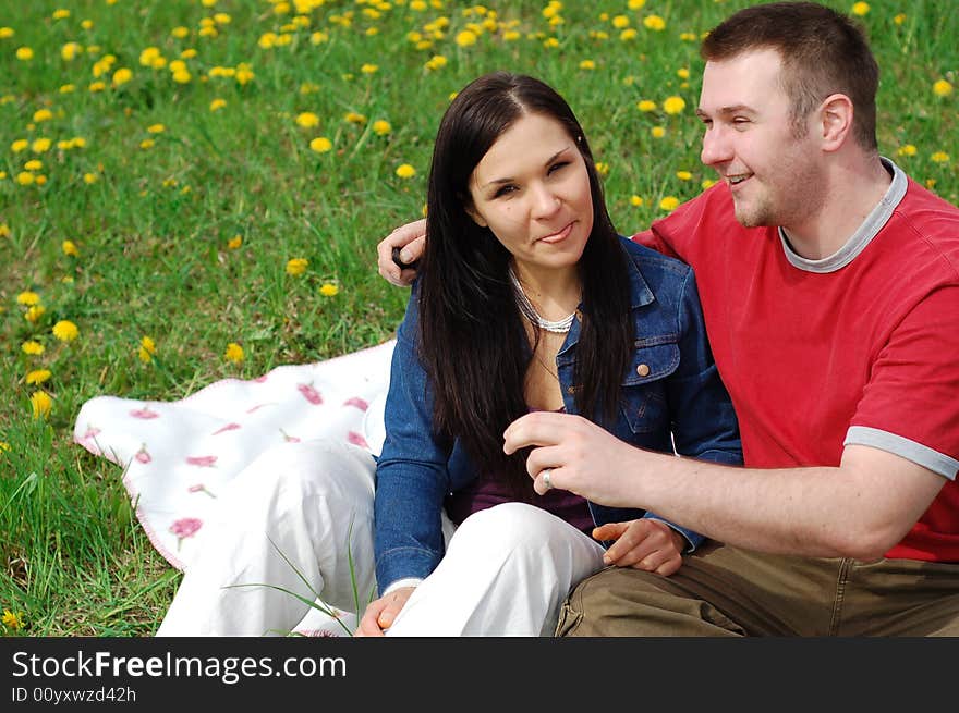 Happy couple on green meadow. Happy couple on green meadow