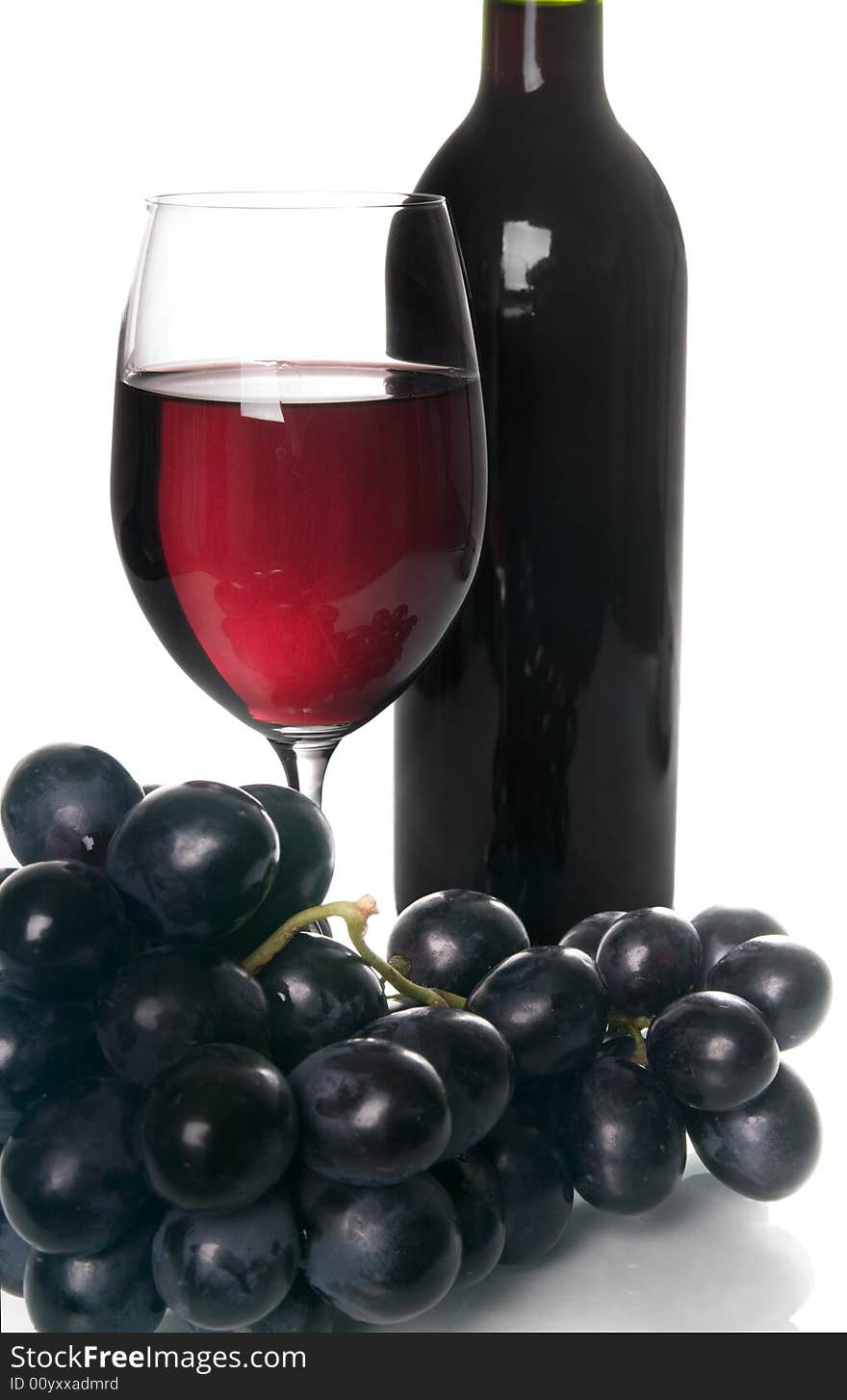 Glass of red wine and grapes. Glass of red wine and grapes.