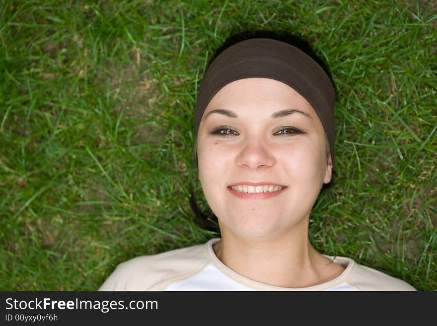 Attractive woman on green grass. Attractive woman on green grass