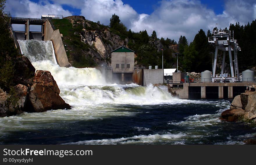 Open spillway and power plant at Cascade Dam, Cascade Idaho. Open spillway and power plant at Cascade Dam, Cascade Idaho