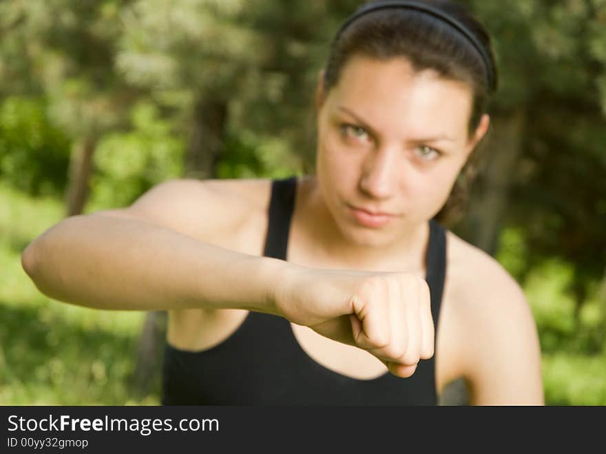 Close-up of fist of young sporty girl, shallow DOF, focus is on the fist