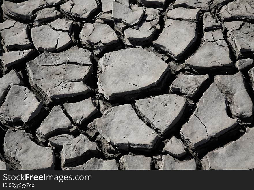 Parched and cracking mud in heat of the sun during drought. Parched and cracking mud in heat of the sun during drought