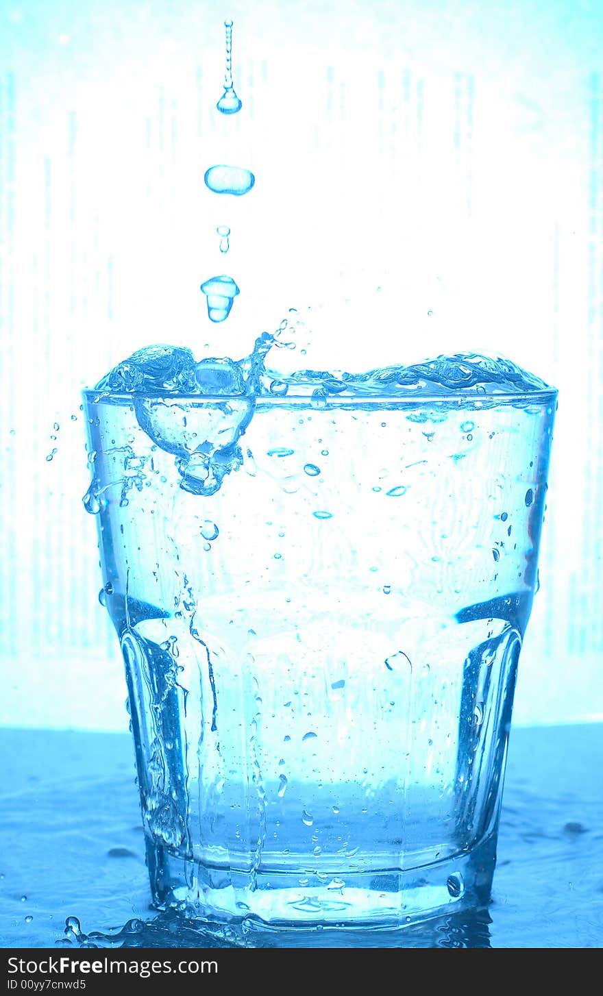 Blue glass and water splash. Blue glass and water splash