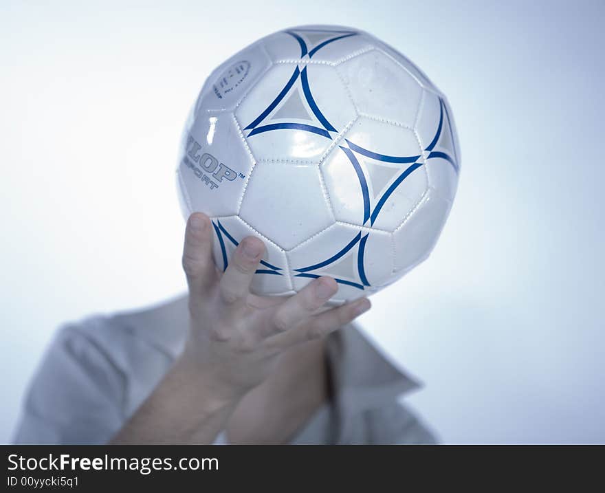 Boy with a ball in front of the face. Boy with a ball in front of the face