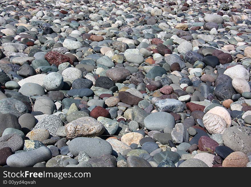 Rounded rocks and pebbles in riverbed. Rounded rocks and pebbles in riverbed