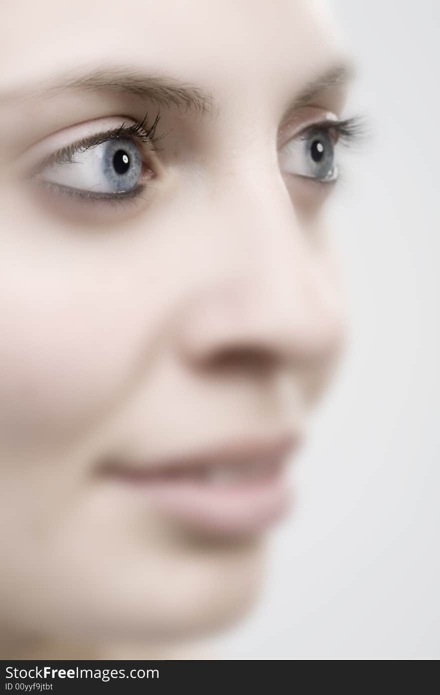 Portrait of a young woman with blue eyes