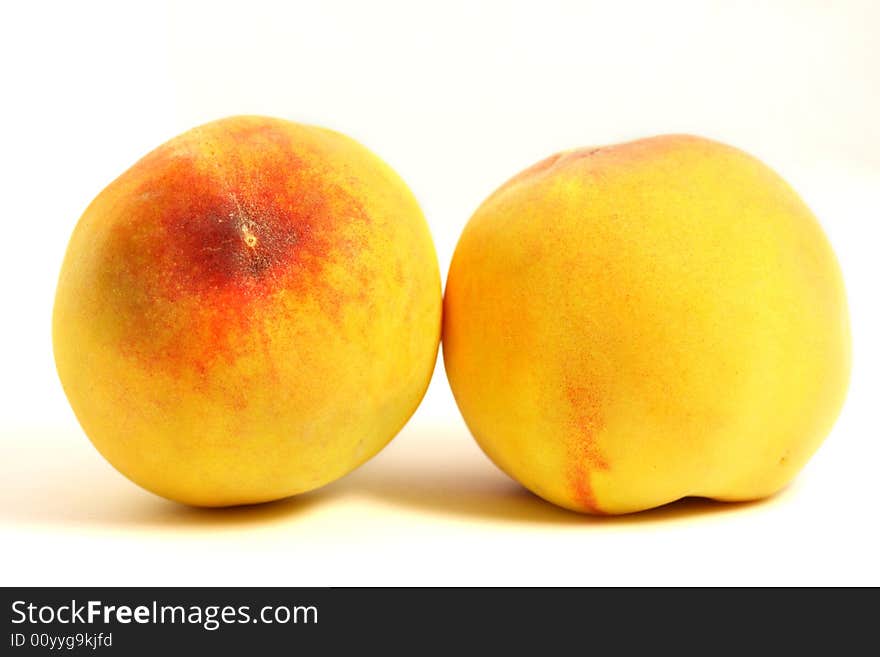 Peaches on isolated white background.