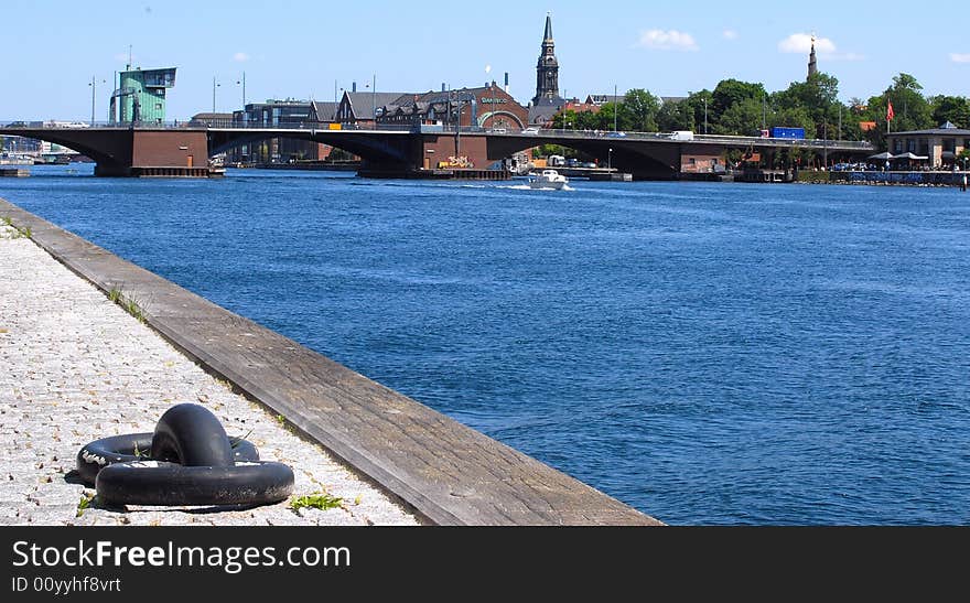 Riverside with a view on the bridge in Copenhagen and a church. Riverside with a view on the bridge in Copenhagen and a church