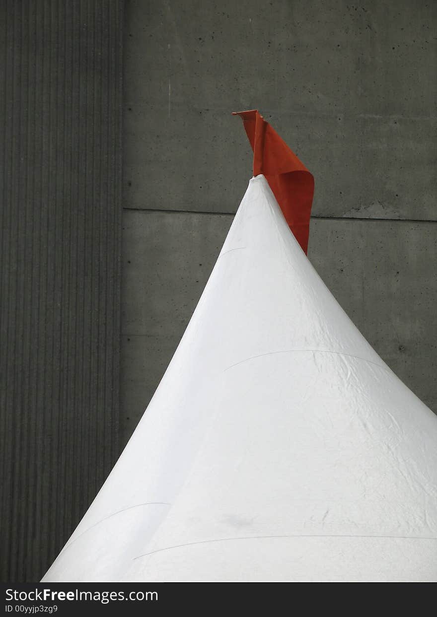 White tent with red flag