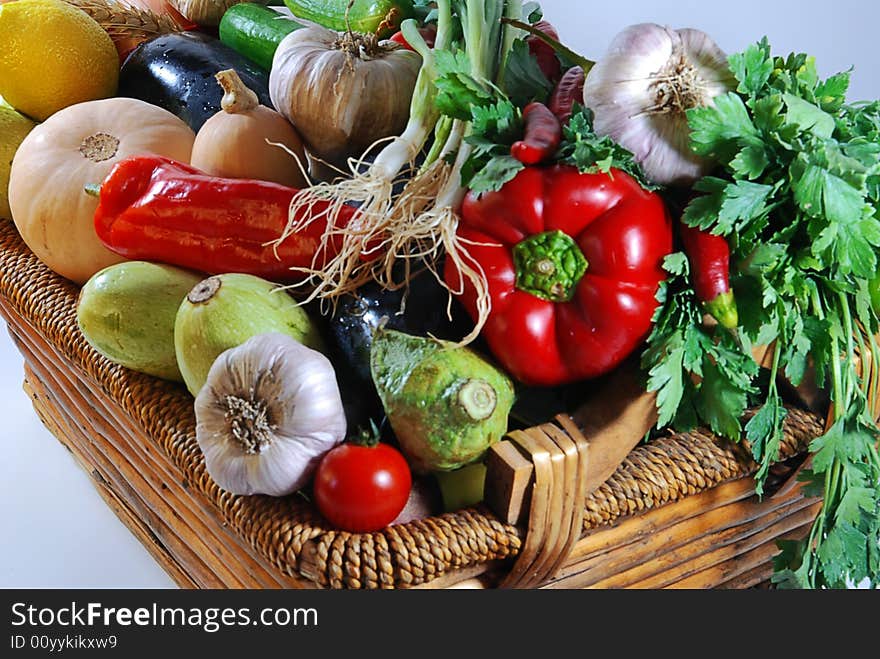 Fresh vegetables like red tomatoes or green cucumber on white