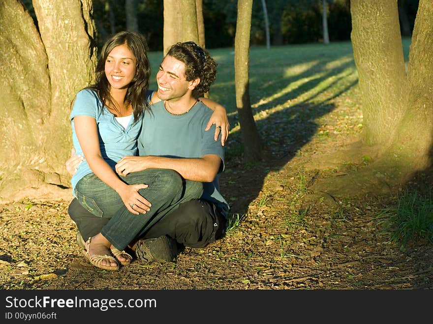 Couple Sitting Under a Shady Tree - Horizontal