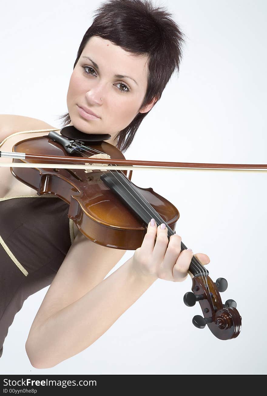 Pretty girl with violin isolated on white. Pretty girl with violin isolated on white