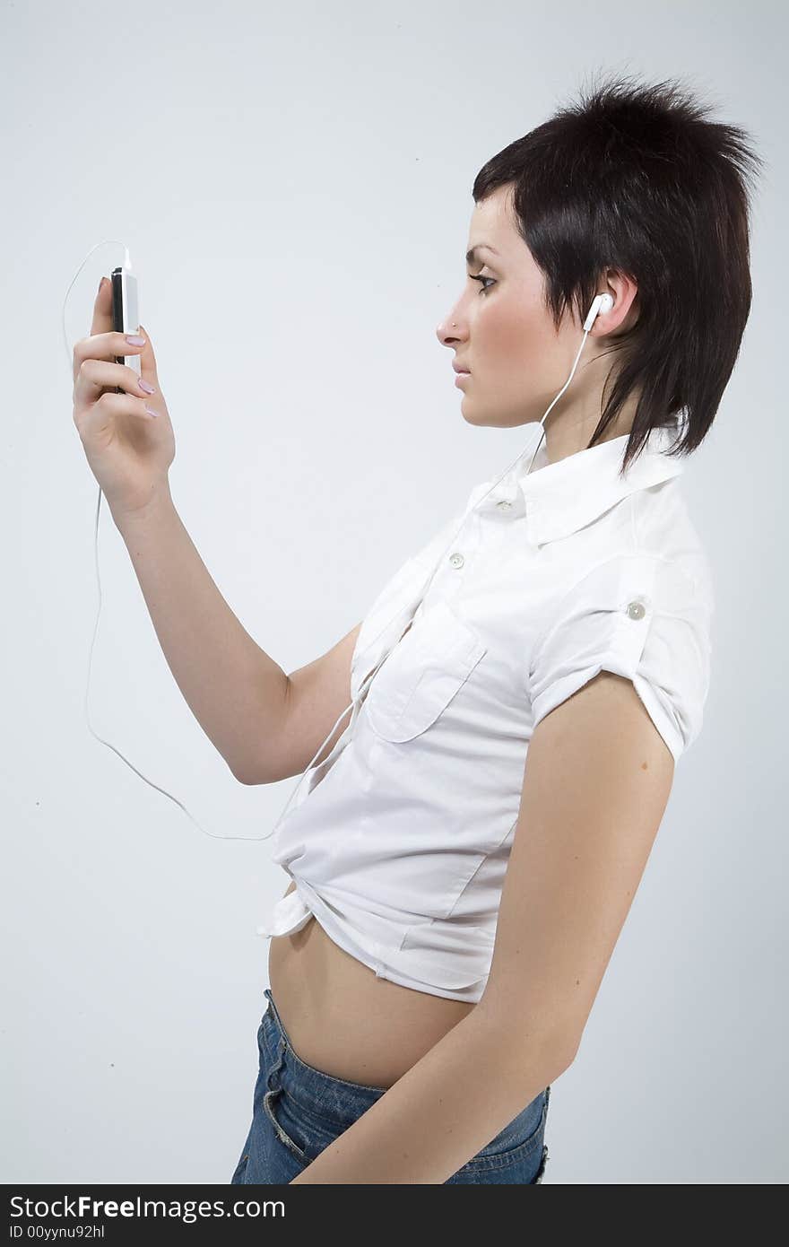 Girl with Mp3-player listening to the music