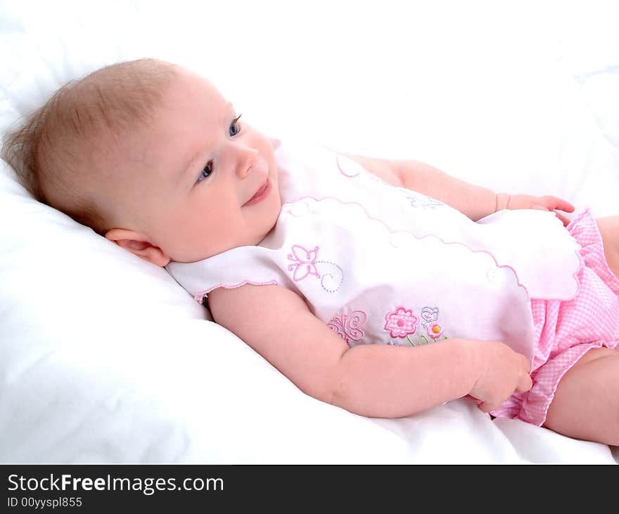 Baby girl lying on white blanket. Baby girl lying on white blanket