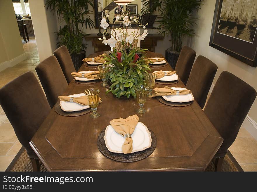 Luxury home dining table with exquisite tableware. Luxury home dining table with exquisite tableware.